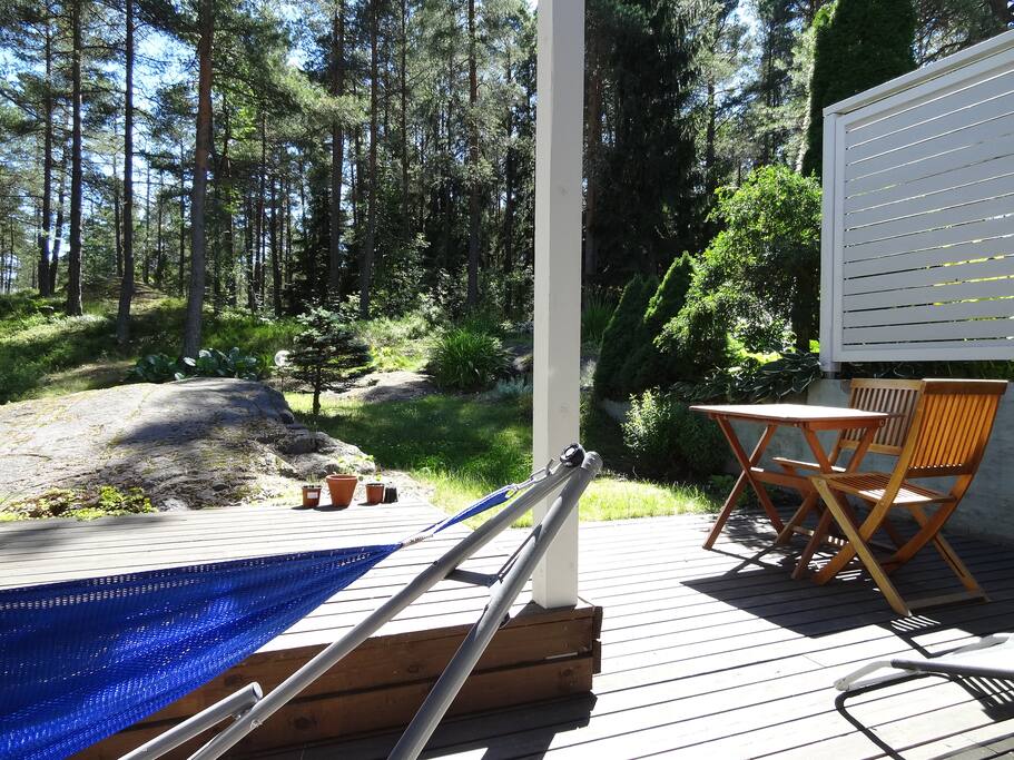Hammock and a sunny deck in summer