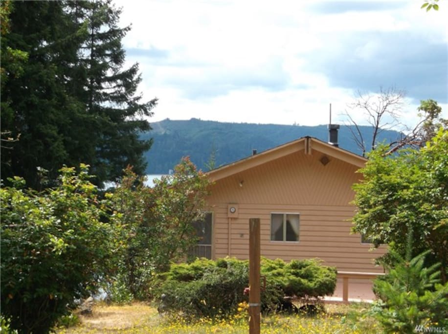 Modest home perched for views, ready for salt water fun.