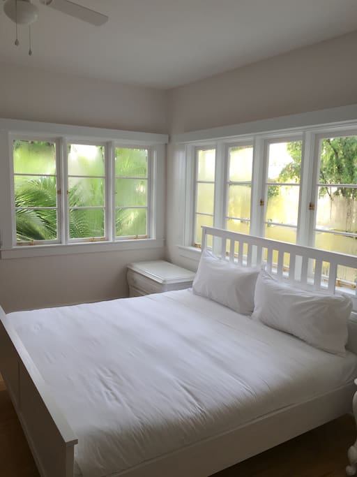 Sweeping windows with views into the courtyard.