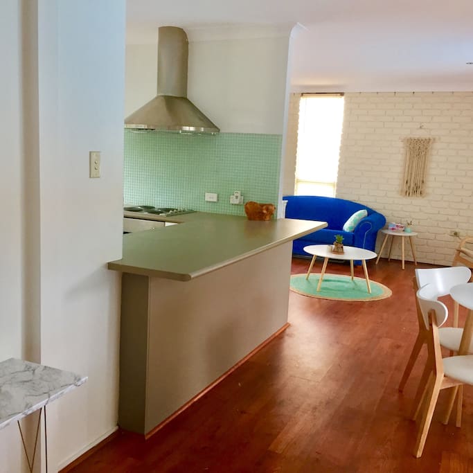 Renovated kitchen - open plan. Looks on pool.