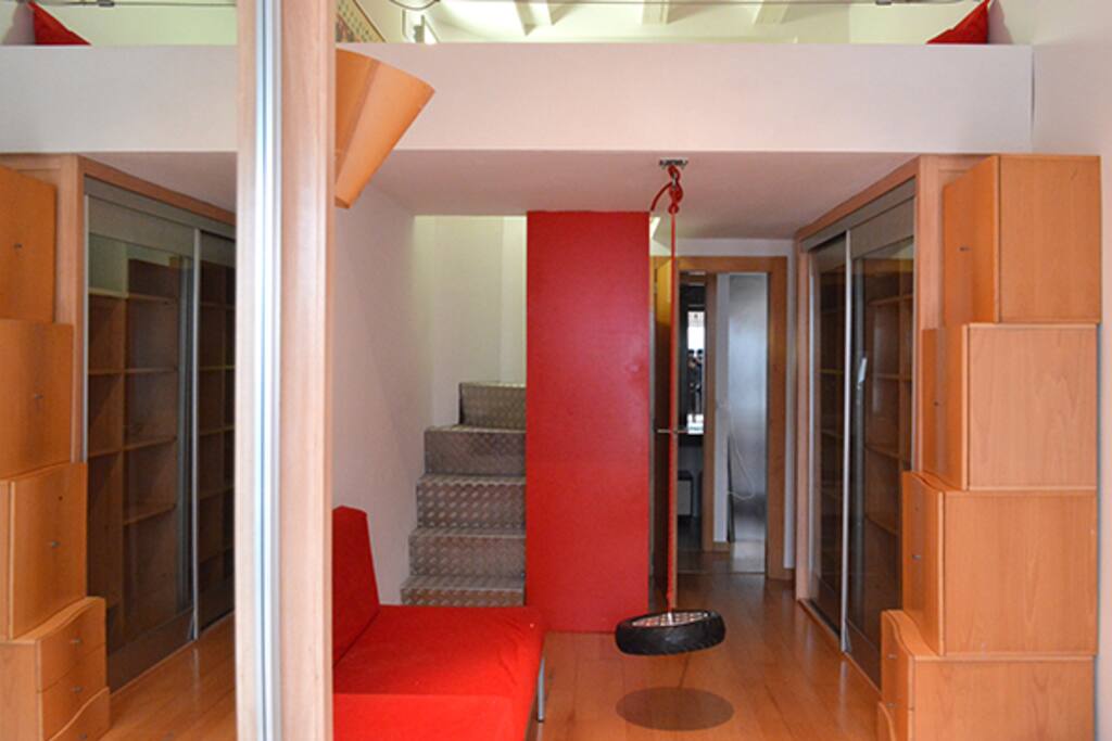 Hugh bedroom with bed in the attic and terrace. Bathroom just at the rear of the pic