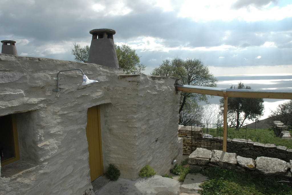 Hello Cyclades! The farmhouse nestles on top of the Aegean sea