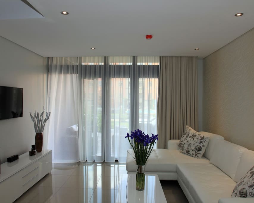 the living room facing the garden and the pool