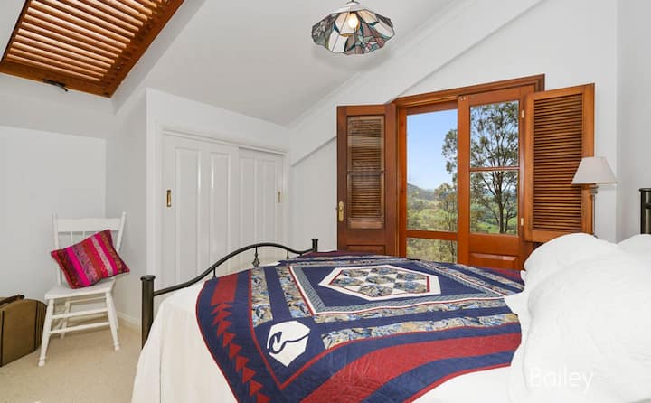 Queen bedroom upstairs in the main house. Wake up with a view!