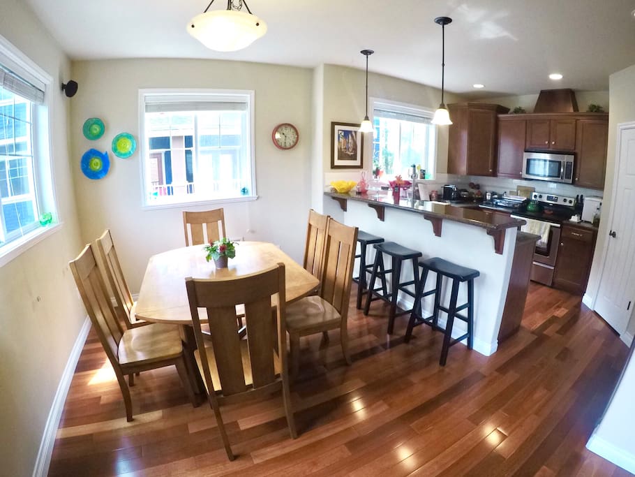 Modern kitchen, and dining area that can seat 4 to 8 people