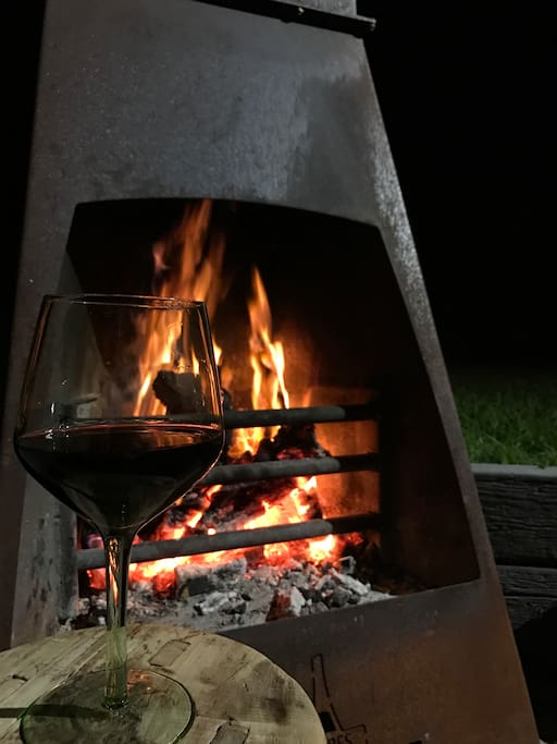 Enjoy a glass of wine around this amazing outdoor fire