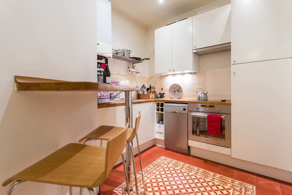 well-equipped kitchen with provencal tiles