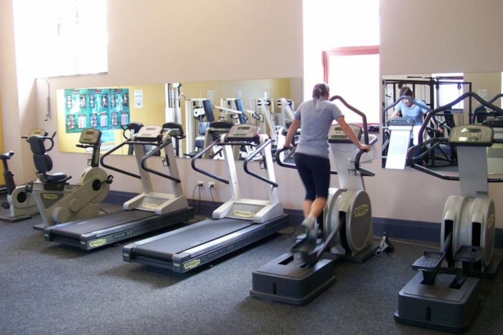 Well equipped communal gym with cardio and weight machines