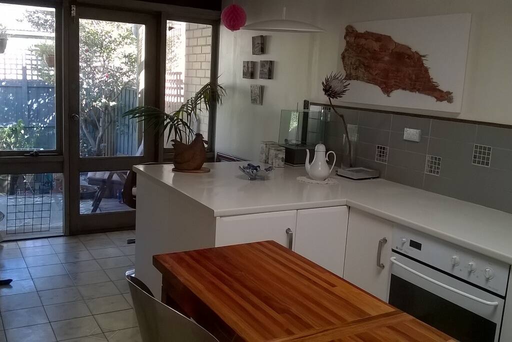 The kitchen, looking towards the south courtyard. The laundry is under the bench on the far side of the kitchen.