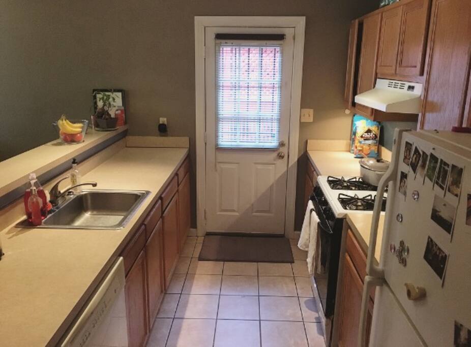 Main entrance thru kitchen, gas stove/oven.