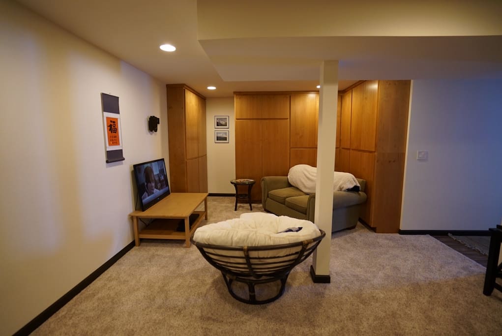 Living room with chair, couch and television