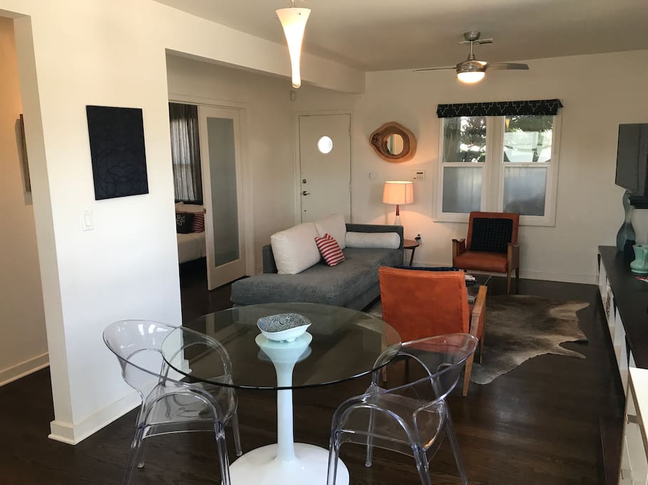 The orange chairs shown are the current chairs in the apartment, much more comfortable than the small chairs in the other photos!