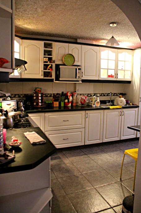 Kitchen with oven, microwave, fridge, washer etc.