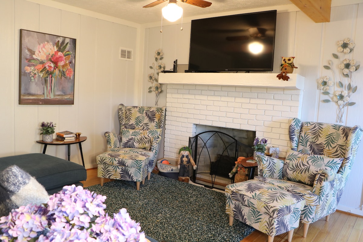 Family Room with electrical fireplace, 55" HDTV, and Blu-Ray DVD player.