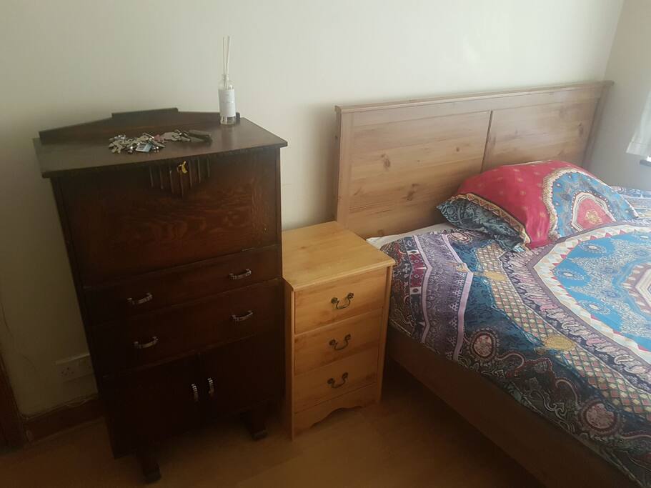 plug points behind the tall cabinet. Plenty of drawers.