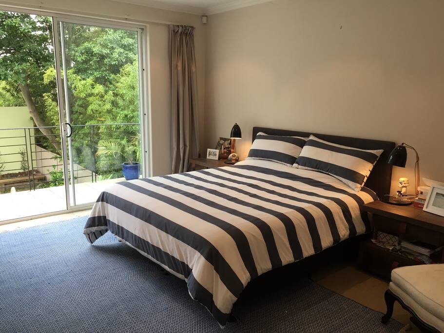 Master bedroom with balcony overlooking back garden
