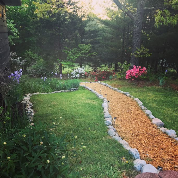 The path in early May, spring and summer is the best time to see the yard! Iris', azaleas, and soon peonies. Lush and green!