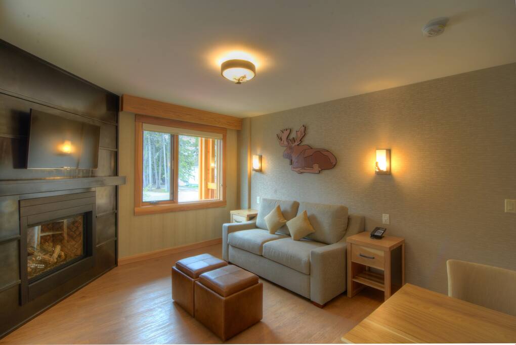 Relax in the bright, open-concept living area with large windows.