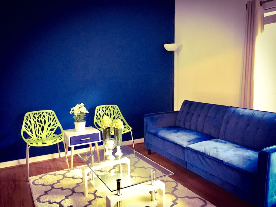 Another view of living area with designer accent wall