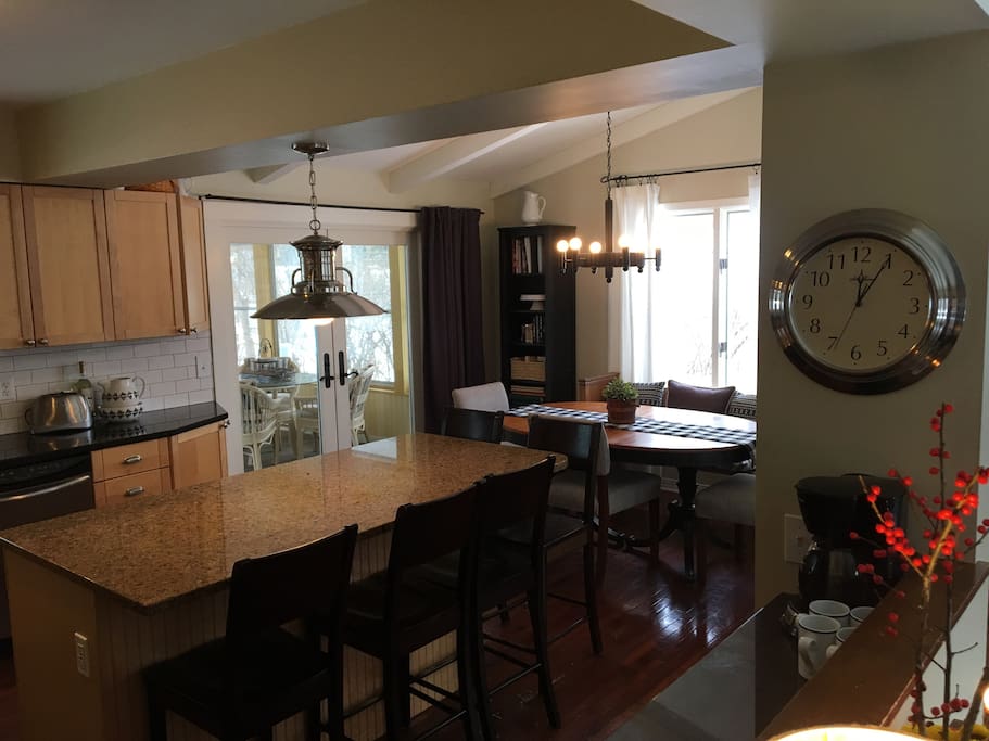 Kitchen opens to dining room and 3 season porch.