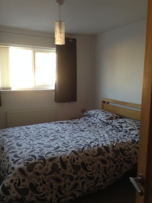 Comfortable Double bed in a light, spacious room