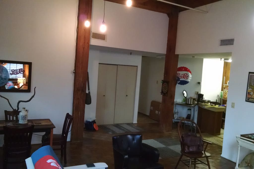 Common Room with exposed brick walls, timber frame and parquet wood floors