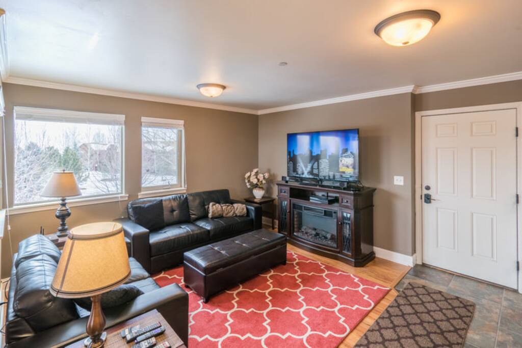 Comfortable living room with big screen tv and roku