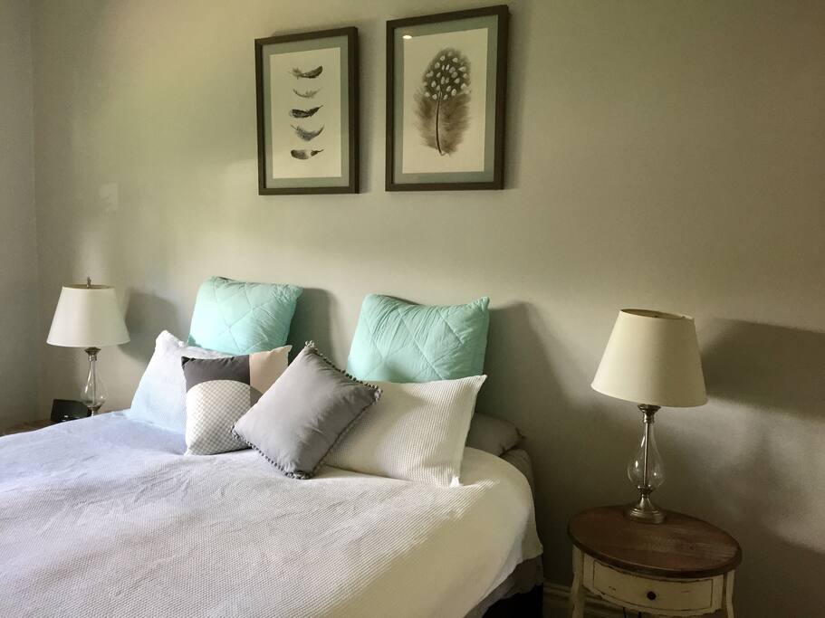 Main bedroom with king sized bed and flat screen TV