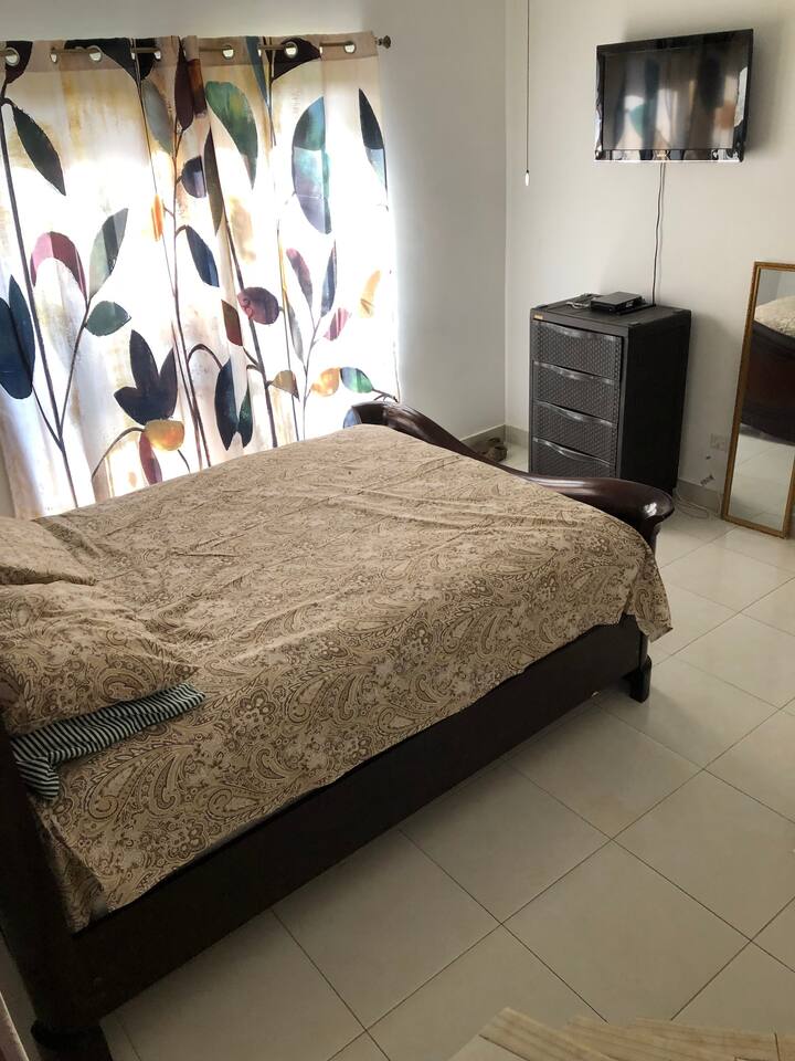 Guest bedroom (and private bathroom) has a queen sized mahogany bed.  Relax and get a good night sleep.  All rooms have ceiling fans and sliding glass doors for fresh mountain air.