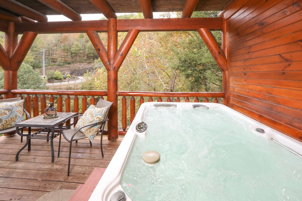 Charming cabin retreat with a luxurious outdoor hot tub overlooking Cove Creek. Professionally managed and maintained by TurnKey Vacation Rentals.