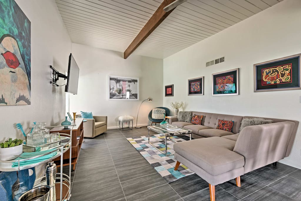 Beat the heat under the living room's exposed beam ceilings.