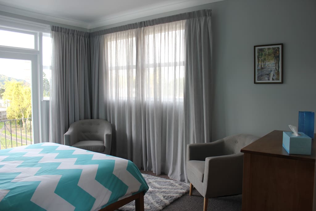 Two comfy armchairs in a sitting area in your room