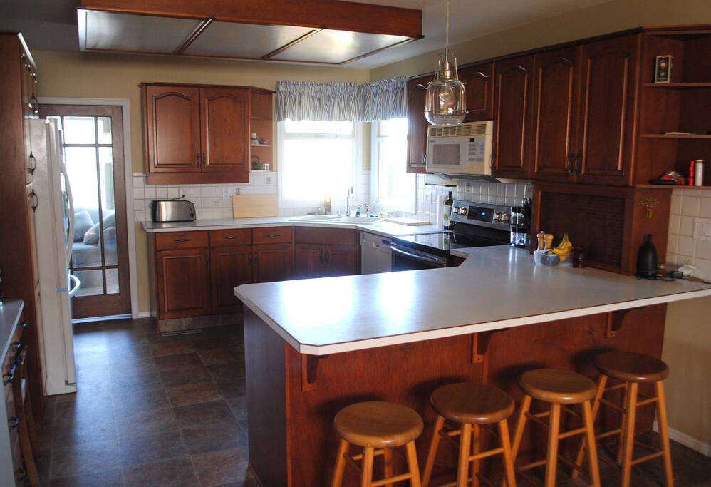 Full kitchen with new stove and microwave