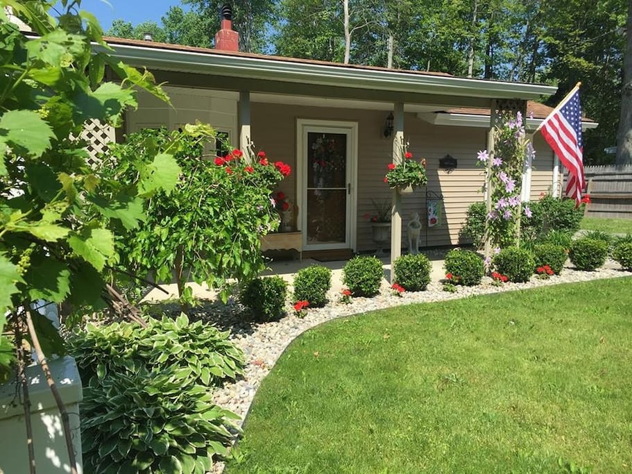 Front of home with shaded overhang porch.