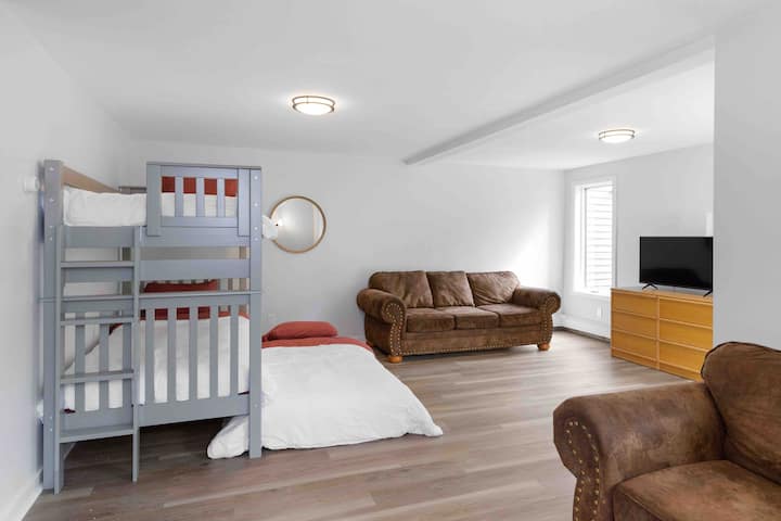 The walkout basement is always a super fun place to be! Bunk bed with a pull out trundle , a couch and love seat allows for the perfect space for kids or a couple! The patio doors exit to the lower patio and a full bath is on the same floor.