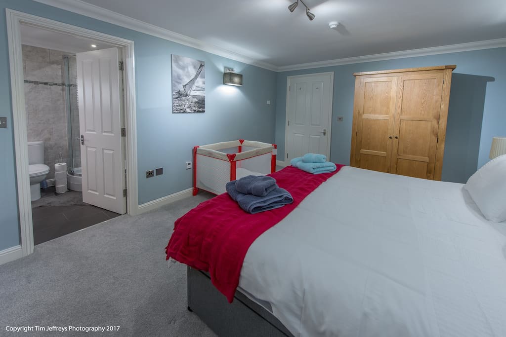 Master Super king bedroom, pictured with optional travel cot.