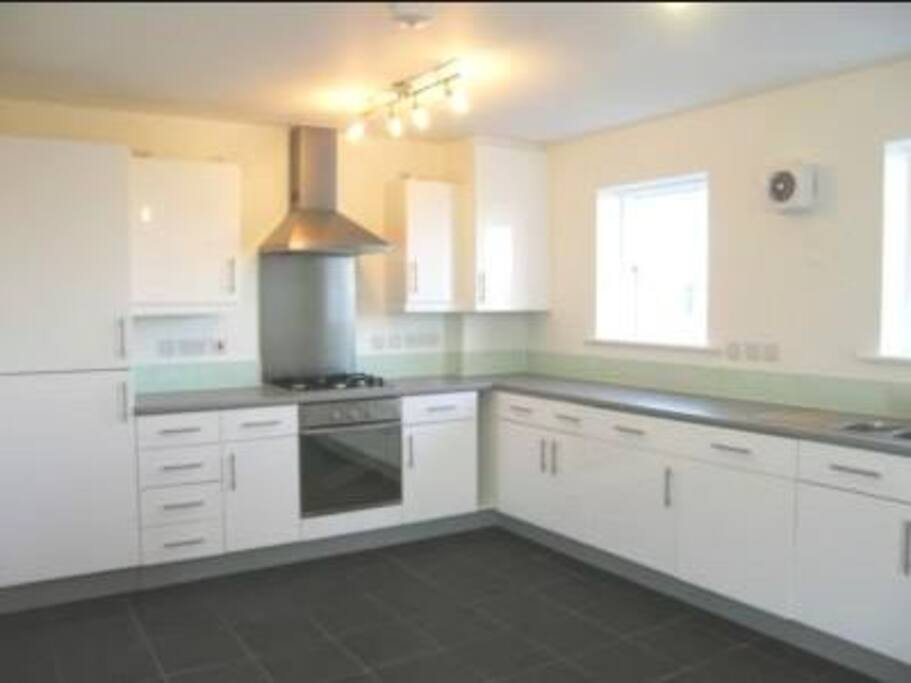 Big kitchen with oven, hub, microwave, etc