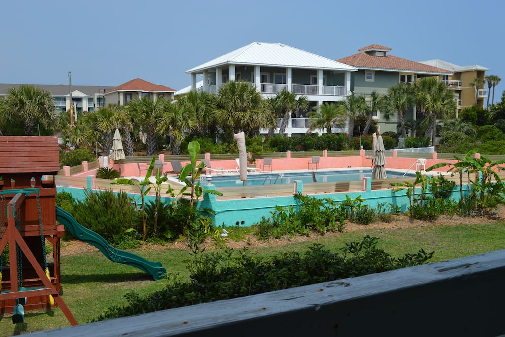 Looking from Condo Balcony to Pool. Houses in background are another complex.
