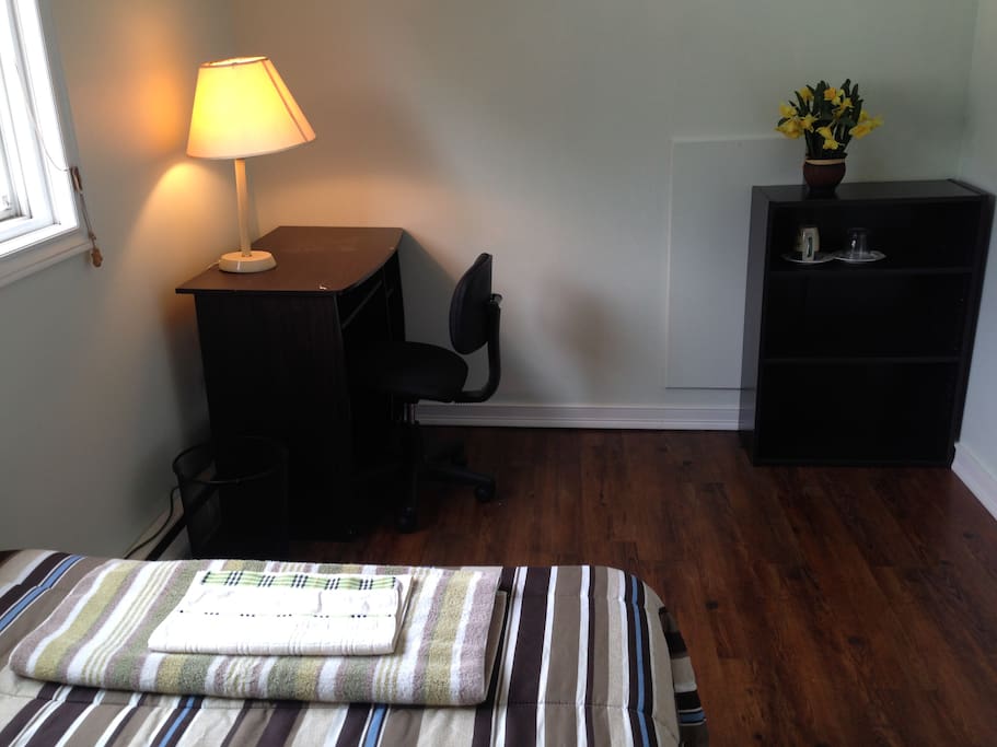 Desk, chair and shelf in the bedroom