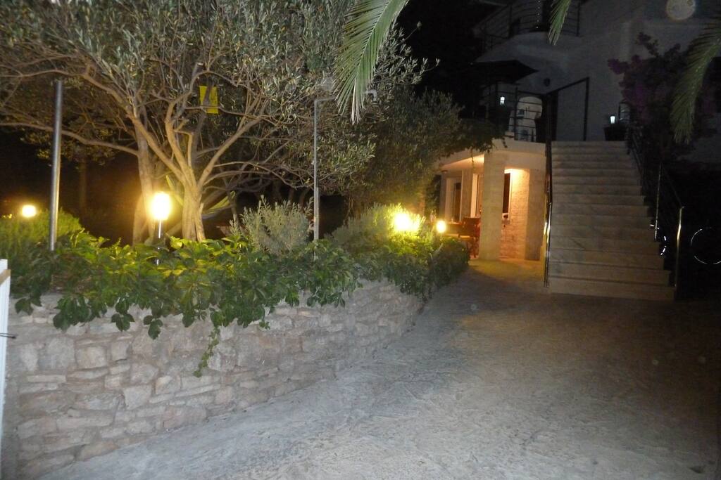 Entrance to villa from the ground floor and driveway with safety gates.