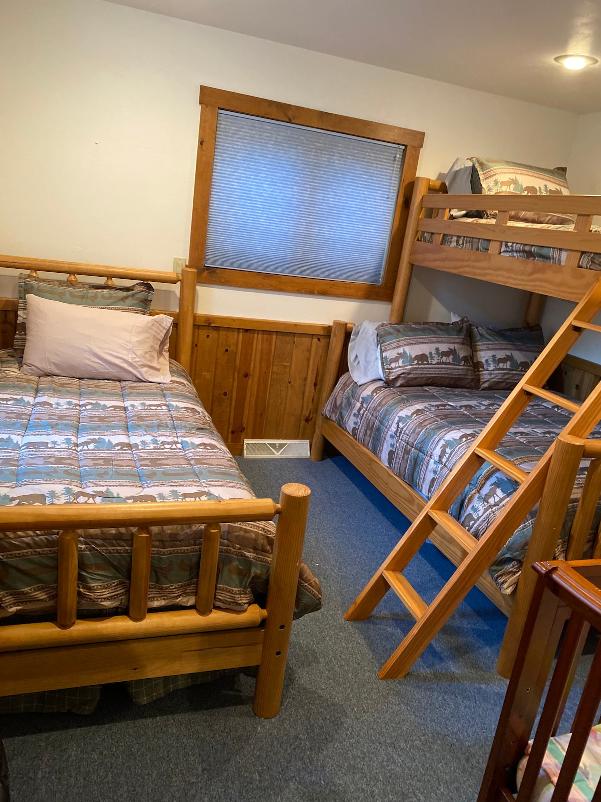 Bedroom has 1 full bed, two twin beds, and a crib.  Crib has a firm memory foam mattress, which is perfect for infants. 