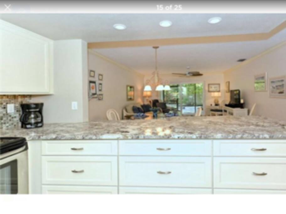 The kitchen area with full granite and stainless appliances and plenty of space.