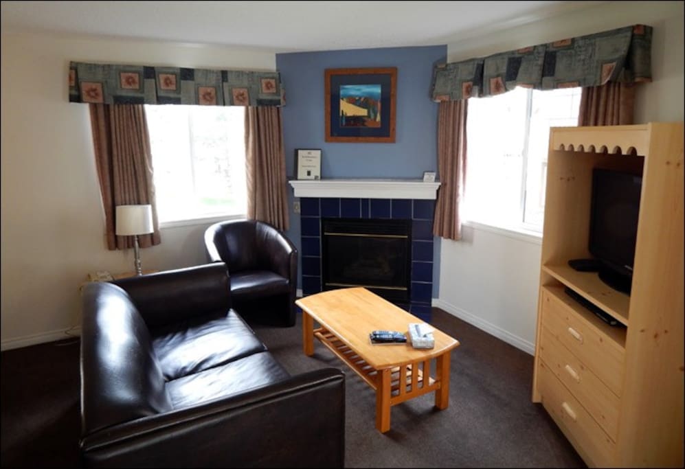 Warm up by the fireplace or entertain at the dining table.
