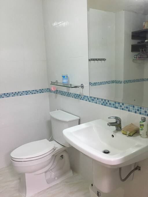 Two toilers; one with shower, the other is the dressing room with toilet.