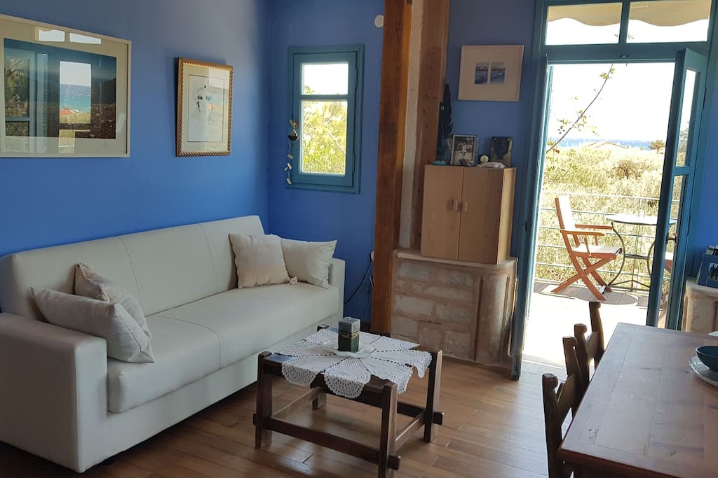 The artistic living room with nice wooden floor and a sofa bed