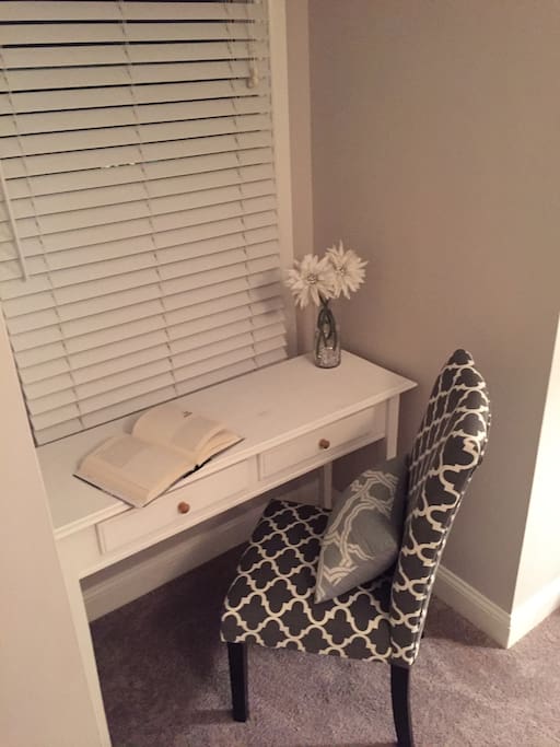 Writing desk and matching chair to catch up on a good read. Charging station for iPhones/iPads keys etc.