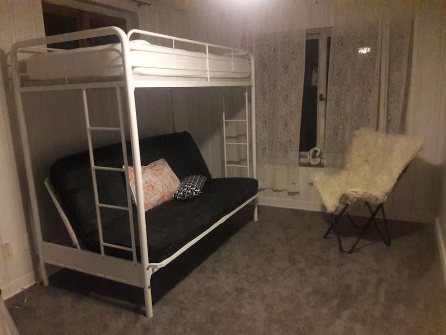 Full size futon on bottom with twin bed on top. Very cozy private bedroom! And who doesn't love bunkbeds?!!