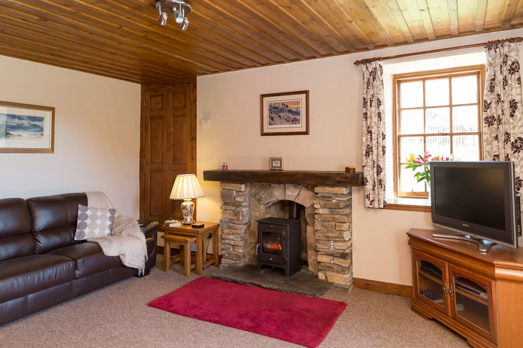 The cosy living room, the perfect space to relax after a day exploring.