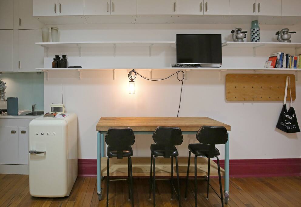 Smeg fridge, digital radio, Bose Blue-tooth speaker, LED TV with apple TV and netflix. Lovely bench with industrial feel and lighting.