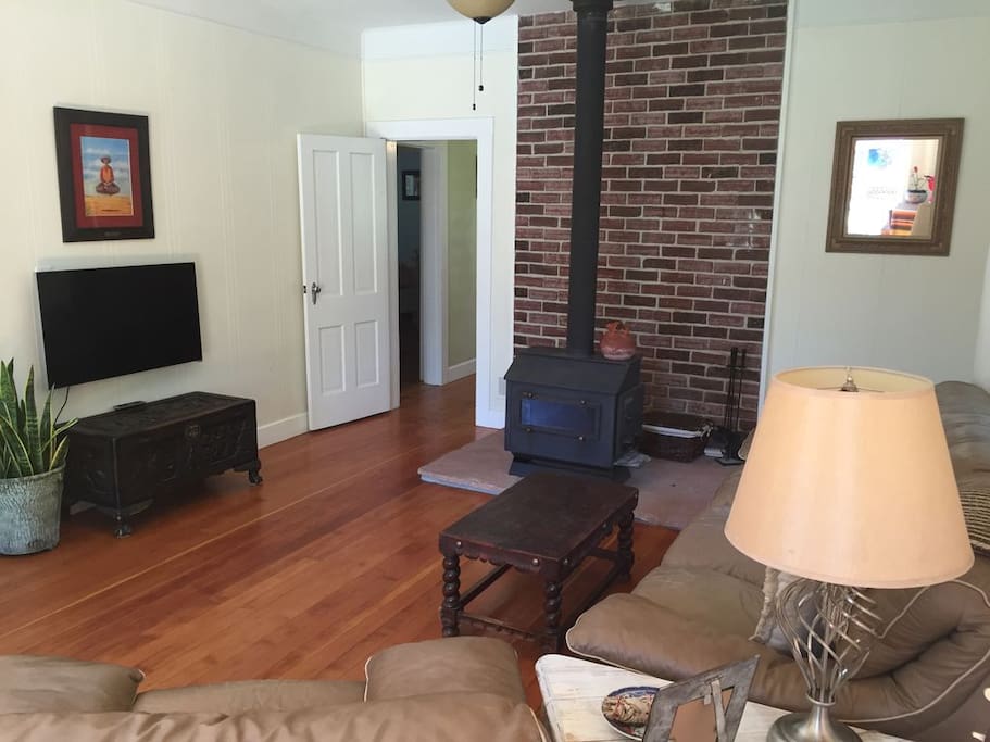 Living room with wood burning stove which works great. We will supply you with plenty of wood to have a fire.